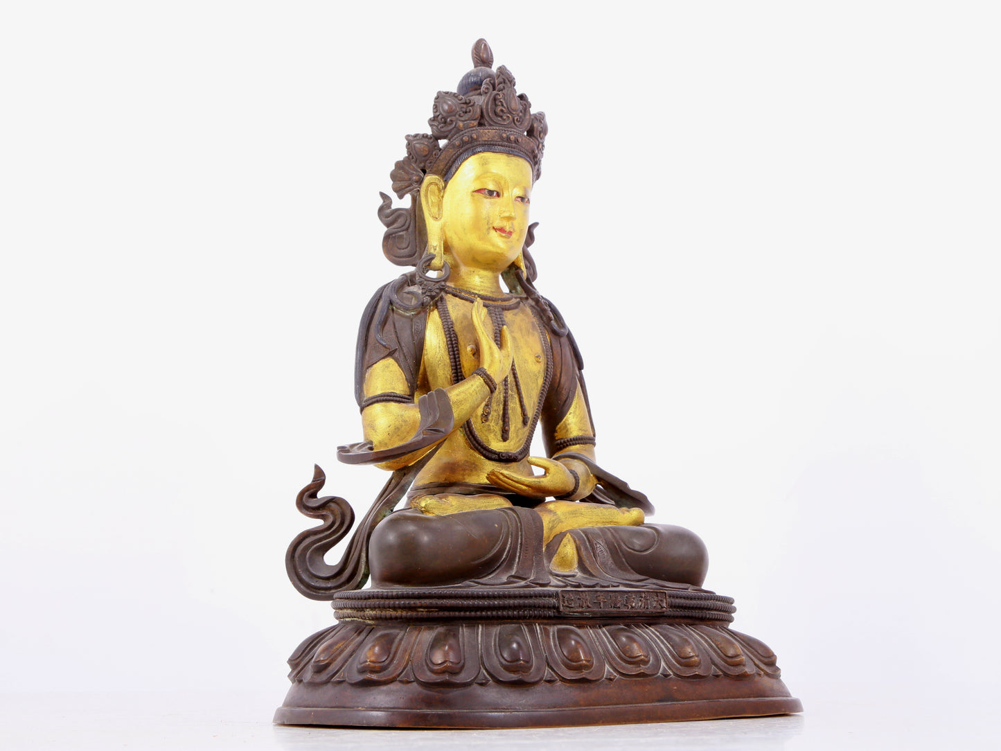 A solemn gilt bronze statue of Bodhisattva