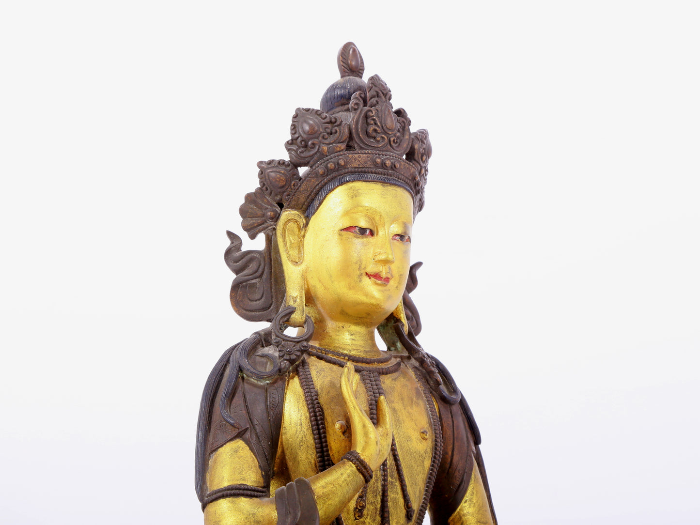 A solemn gilt bronze statue of Bodhisattva