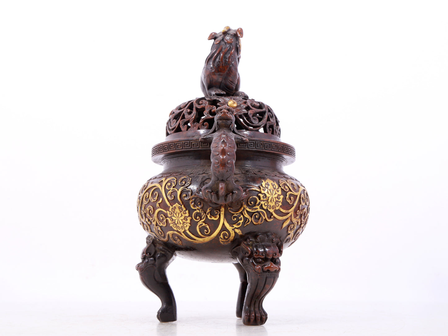 An exquisite gilt bronze censer with double ears and three legs with lotus and auspicious animal patterns.