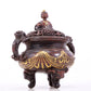 An exquisite gilt bronze elephant-patterned two-eared and tripod censer with lid