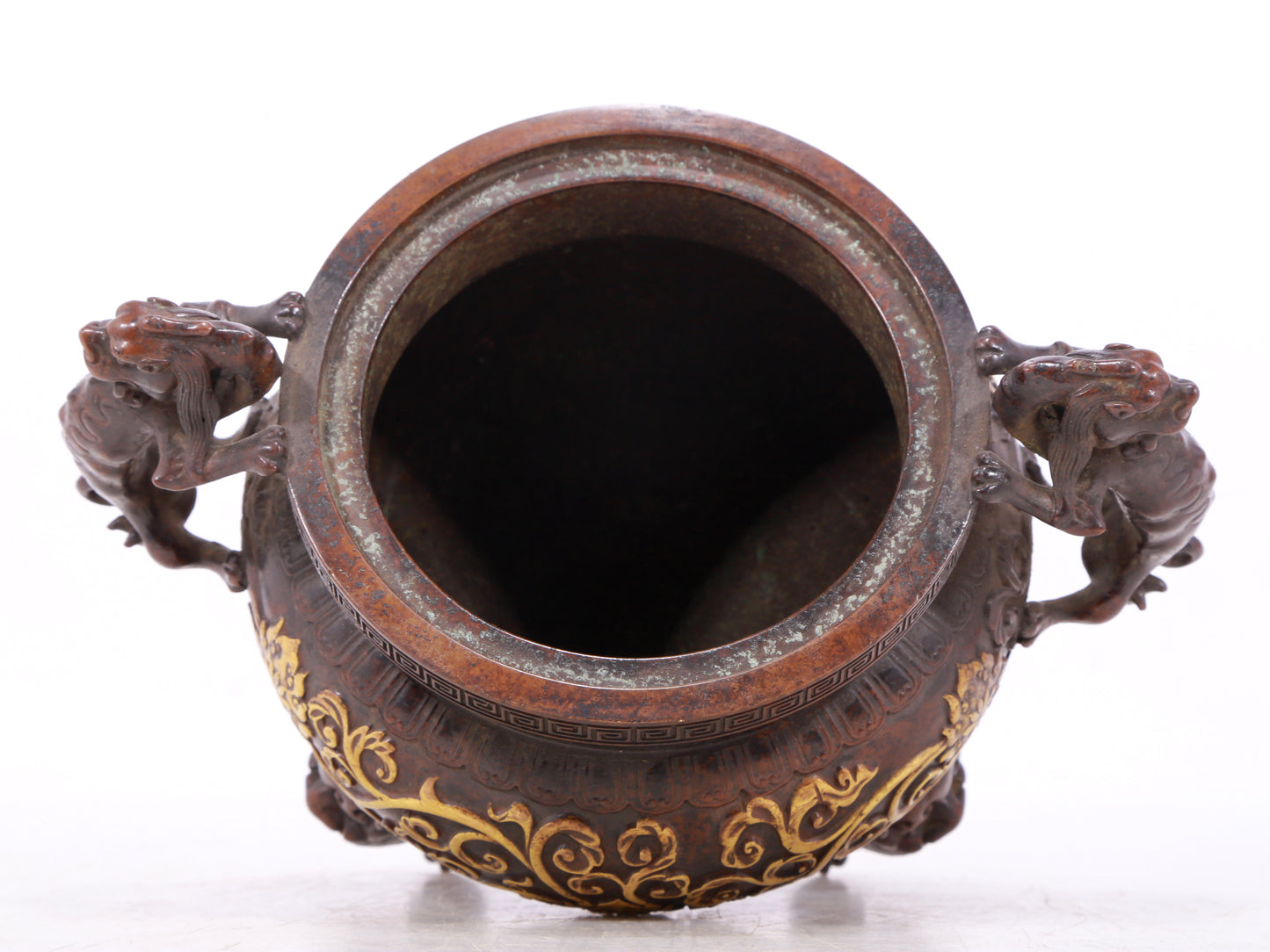 An exquisite gilt bronze censer with double ears and three legs with lotus and auspicious animal patterns.