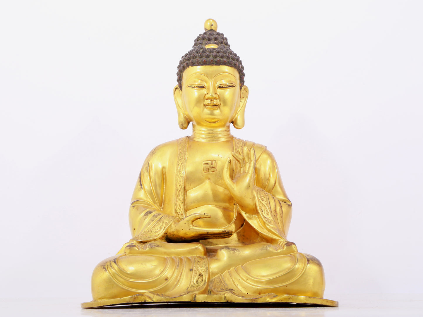 Three solemn gilt bronze statues of Sakyamuni