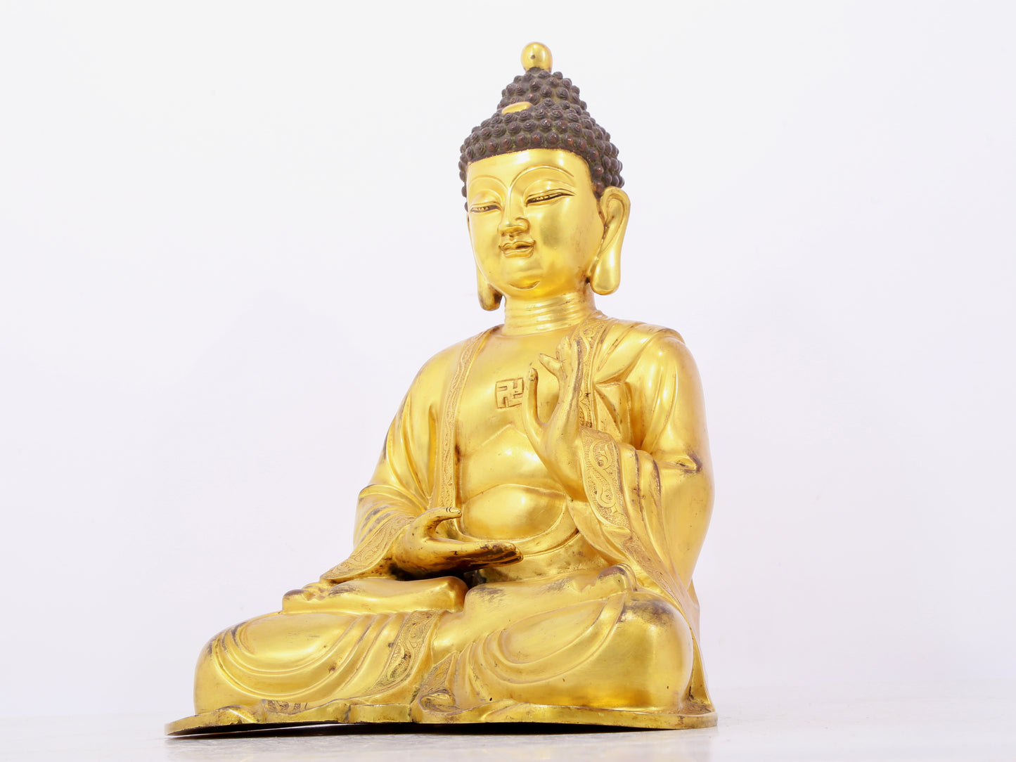 Three solemn gilt bronze statues of Sakyamuni