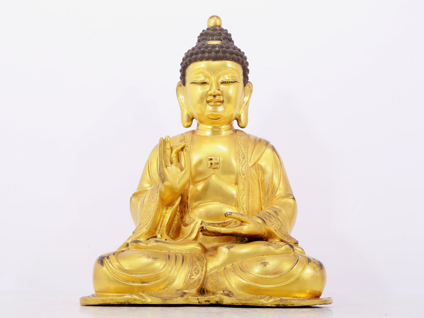 Three solemn gilt bronze statues of Sakyamuni