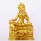 A solemn gilt bronze statue of green Tara