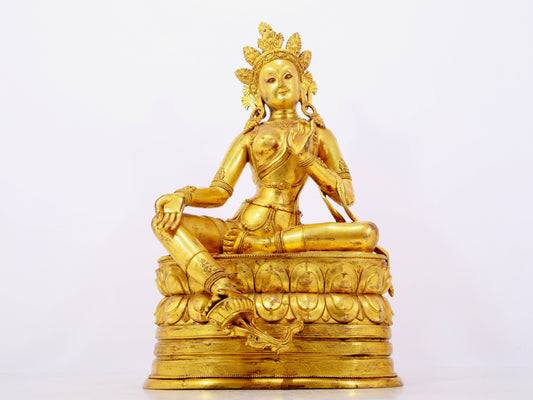 A solemn gilt bronze statue of green Tara