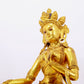 A solemn gilt bronze statue of green Tara