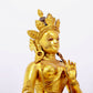 A solemn gilt bronze statue of green Tara