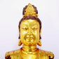 A solemn gilt bronze statue of Guanyin