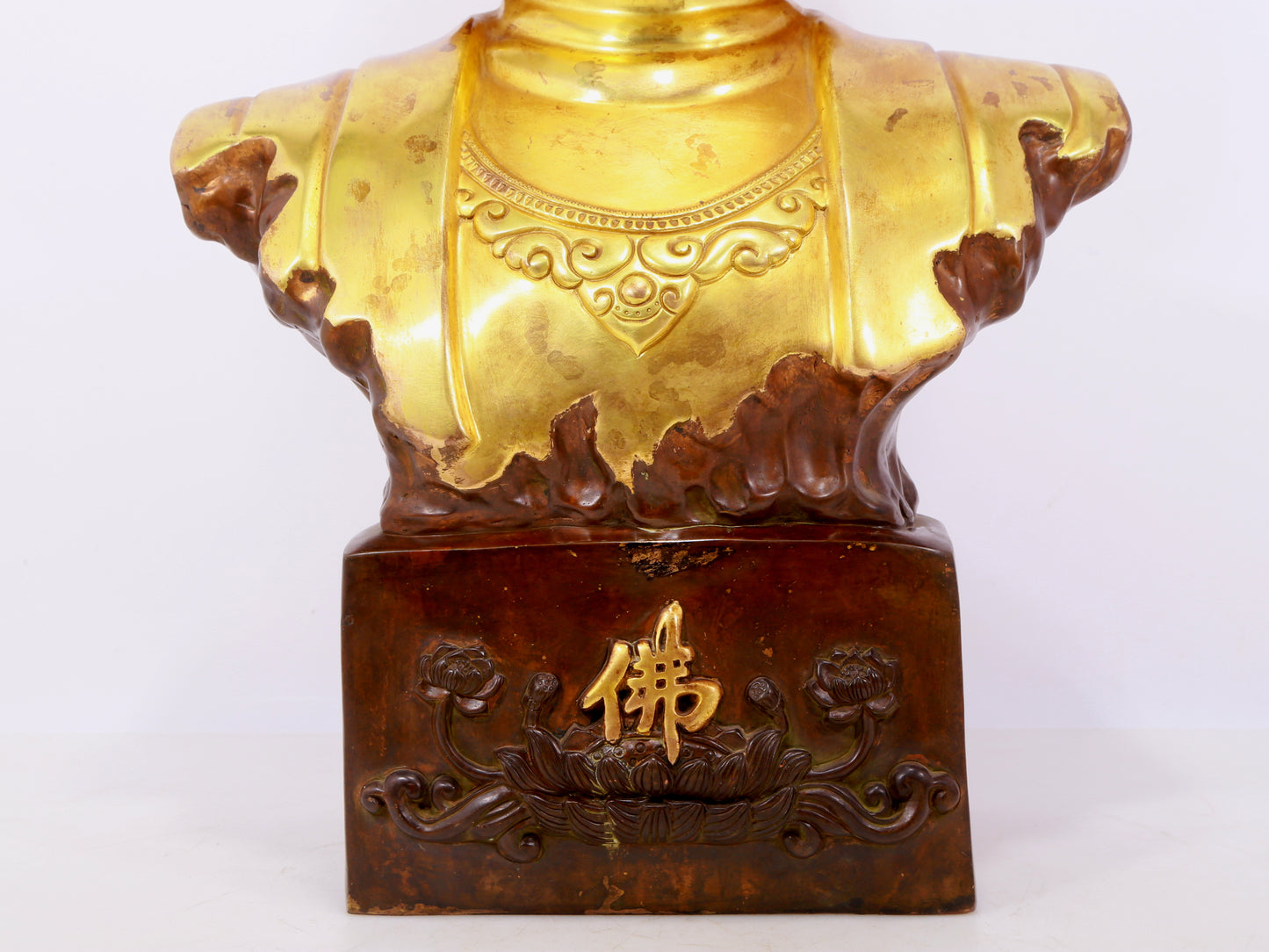 A solemn gilt bronze statue of Guanyin