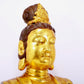 A solemn gilt bronze statue of Guanyin