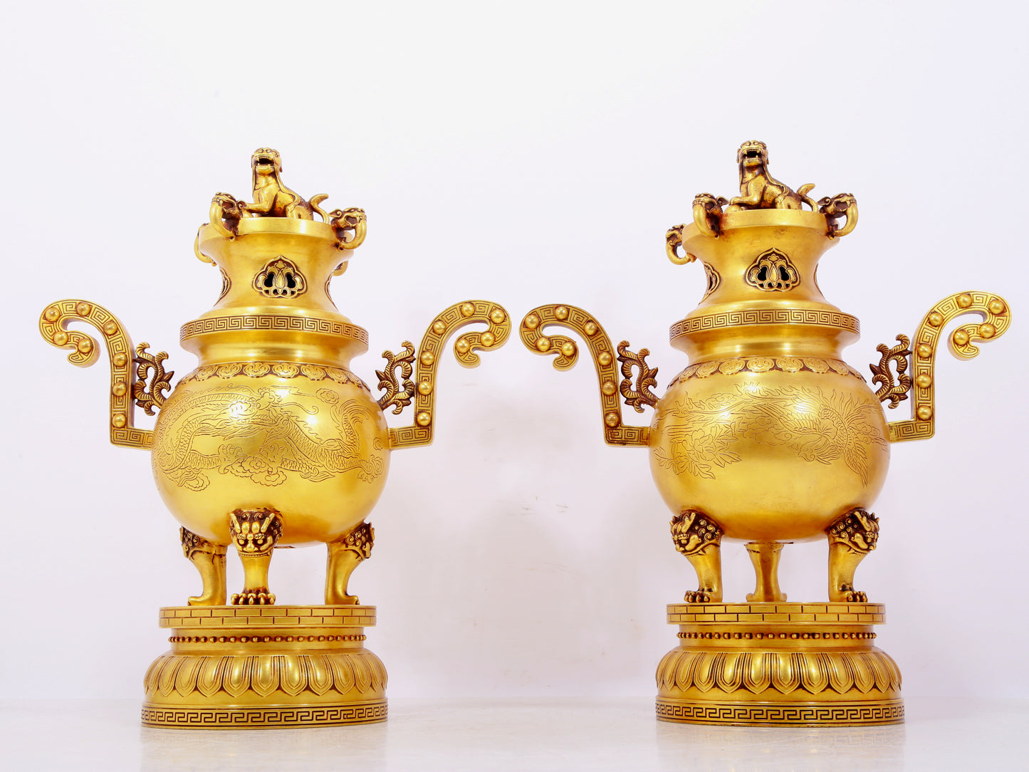 A pair of exquisite gilt bronze phoenix and flower pattern double-eared and three-legged incense burners