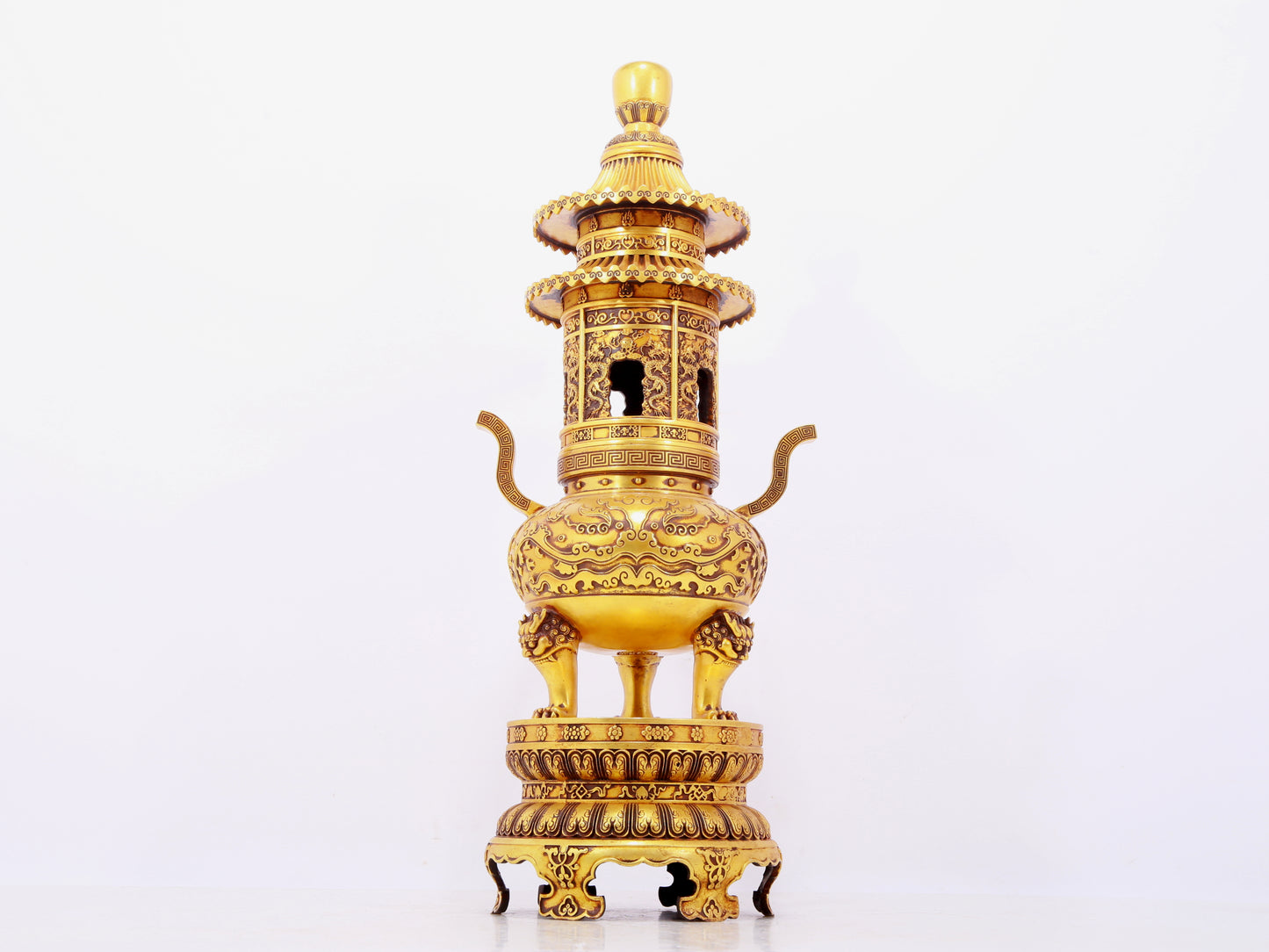 A pair of exquisite gilt copper three-legged incense burners with animal faces and two ears