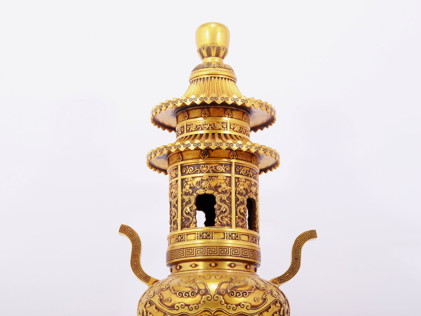 A pair of exquisite gilt copper three-legged incense burners with animal faces and two ears