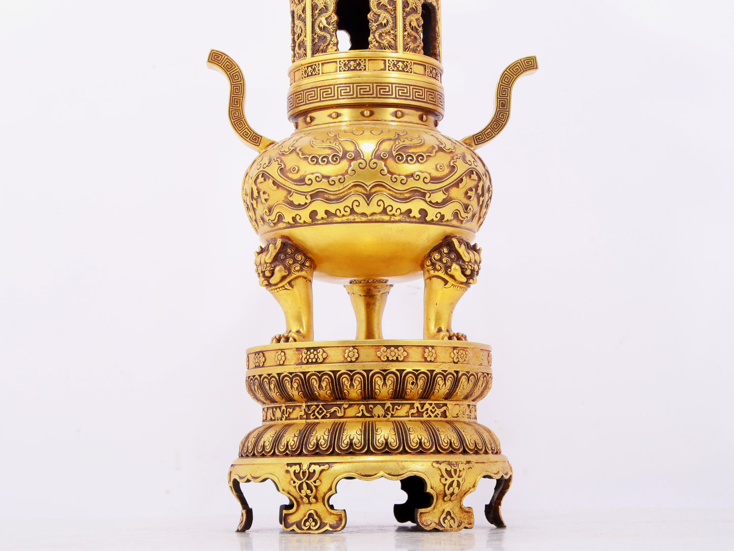 A pair of exquisite gilt copper three-legged incense burners with animal faces and two ears