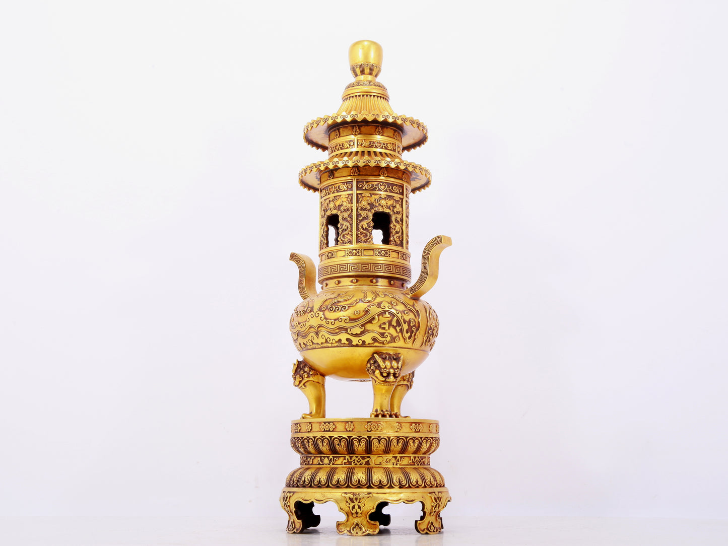 A pair of exquisite gilt copper three-legged incense burners with animal faces and two ears