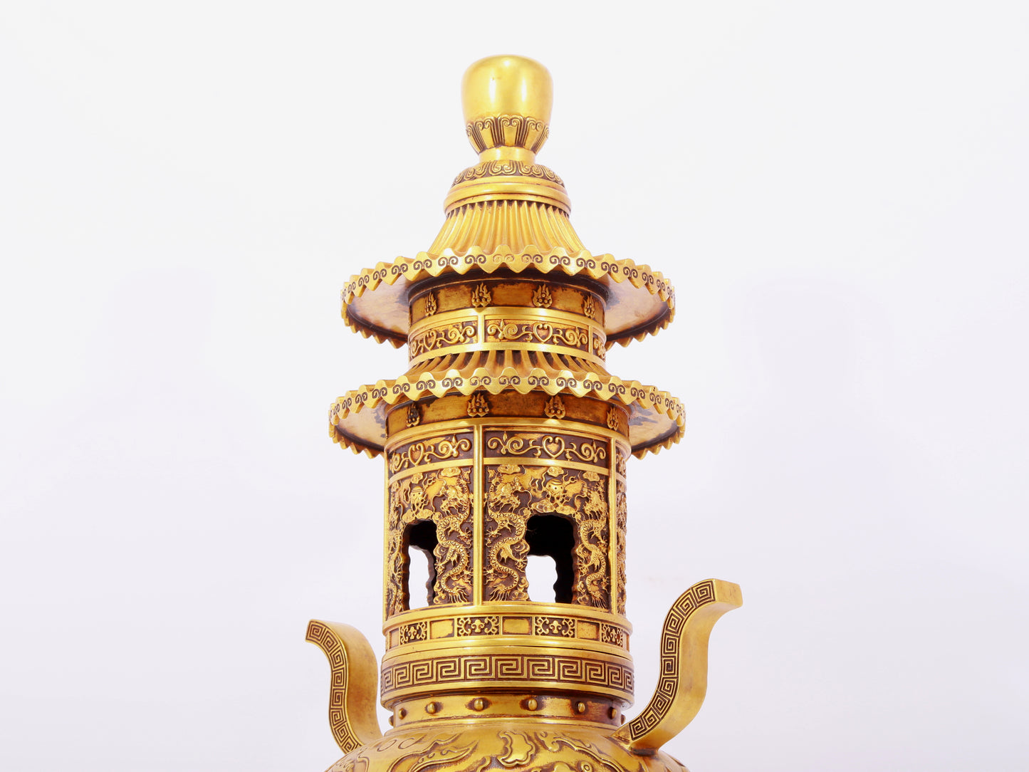 A pair of exquisite gilt copper three-legged incense burners with animal faces and two ears