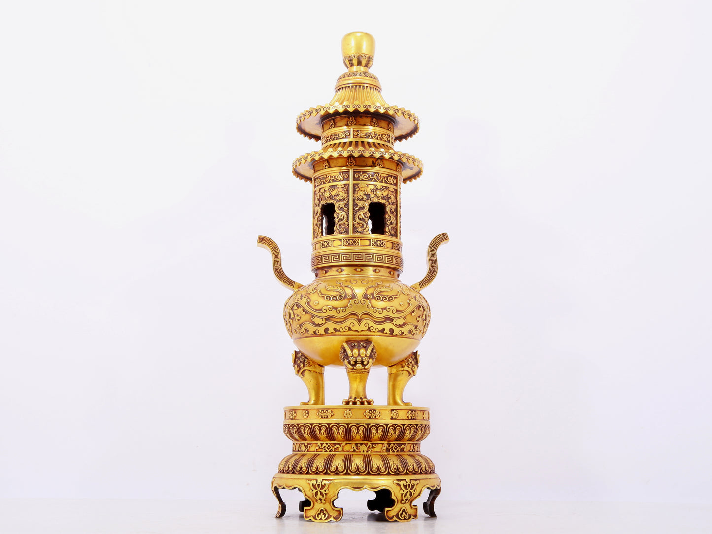 A pair of exquisite gilt copper three-legged incense burners with animal faces and two ears