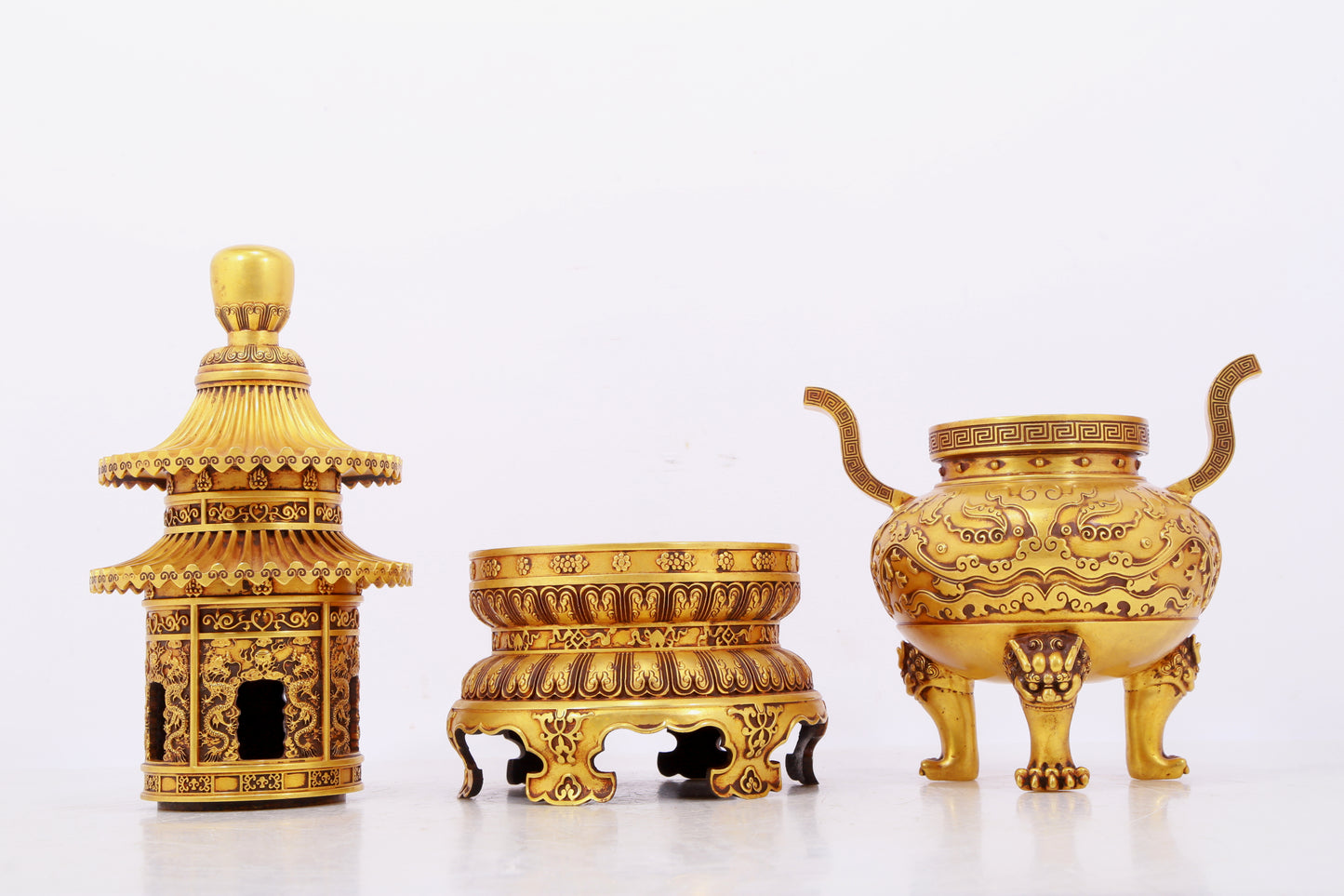 A pair of exquisite gilt copper three-legged incense burners with animal faces and two ears