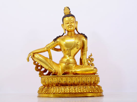 A solemn gilt bronze statue of Guanyin