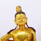 A solemn gilt bronze statue of Guanyin