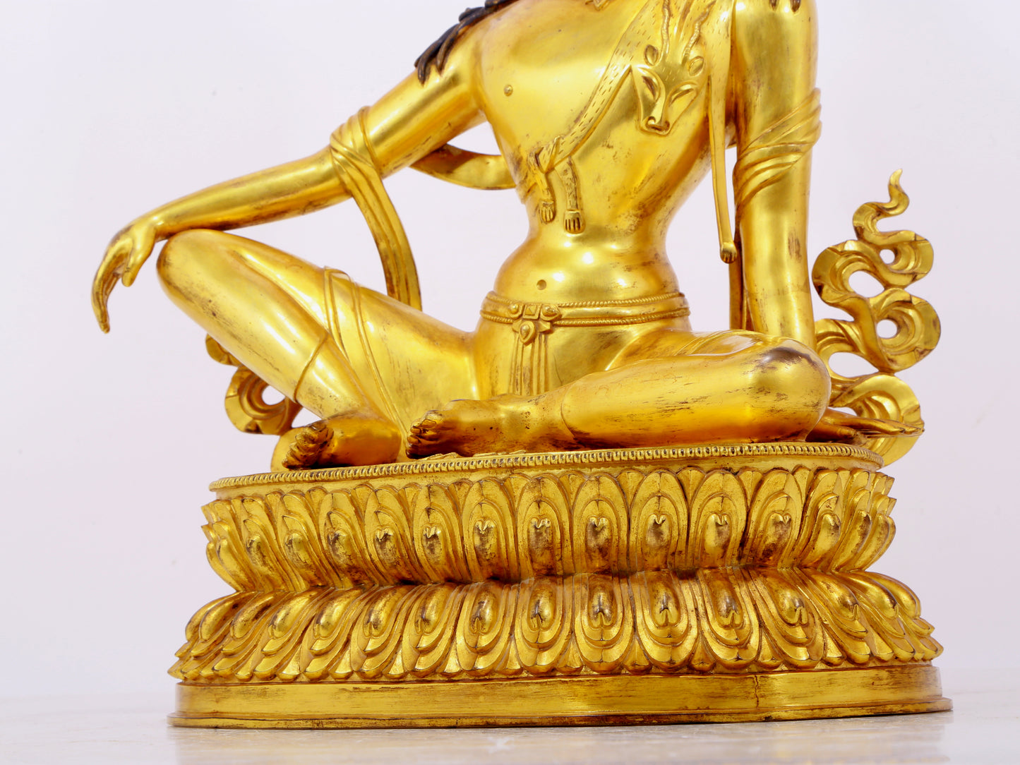 A solemn gilt bronze statue of Guanyin