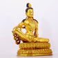 A solemn gilt bronze statue of Guanyin