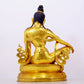 A solemn gilt bronze statue of Guanyin