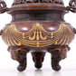 An exquisite gilt bronze elephant-patterned two-eared and tripod censer with lid