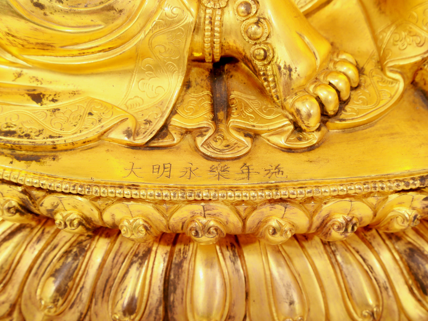 A solemn gilt bronze statue of Guanyin