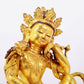 A solemn gilt bronze statue of Guanyin