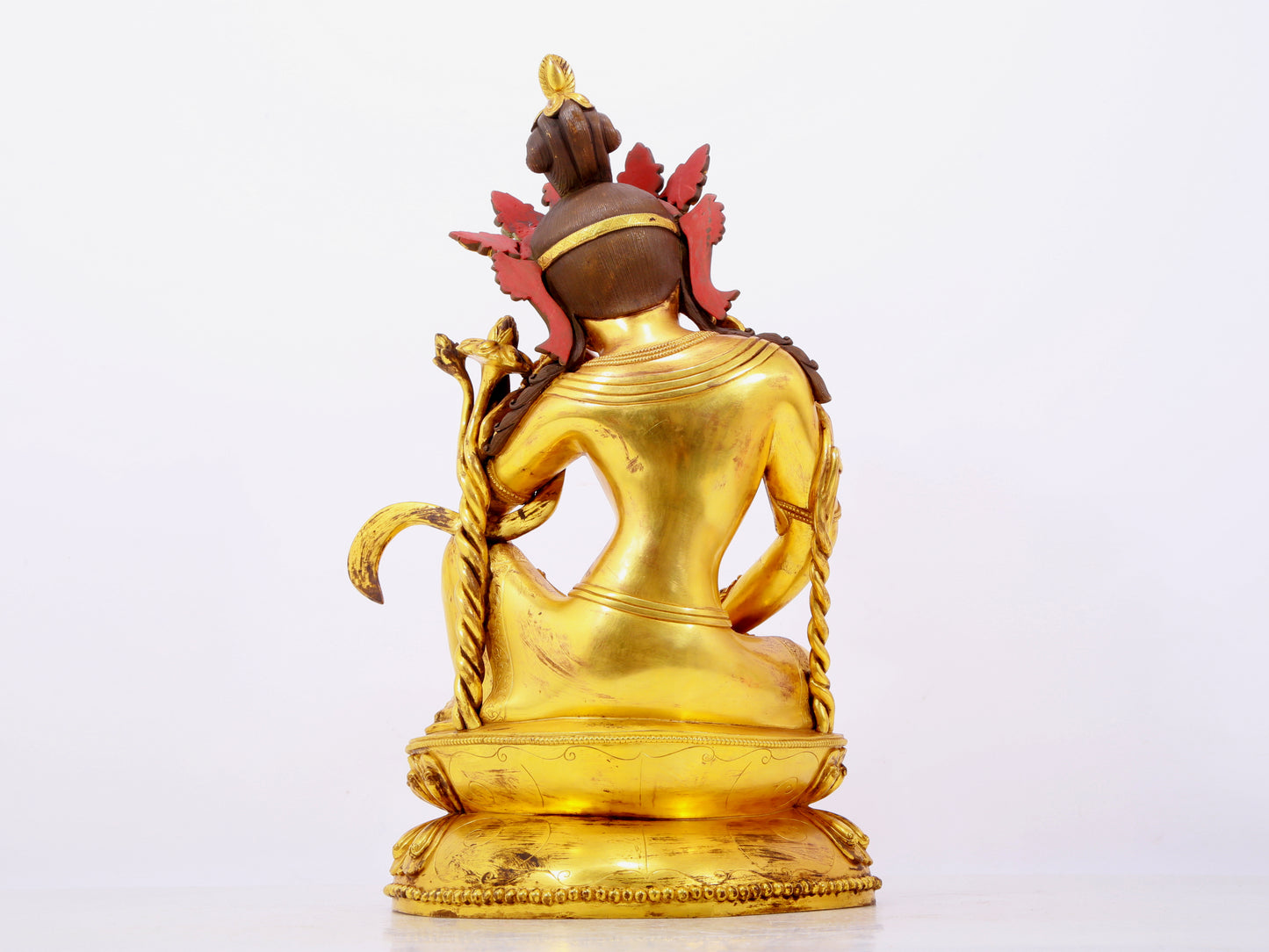 A solemn gilt bronze statue of Guanyin