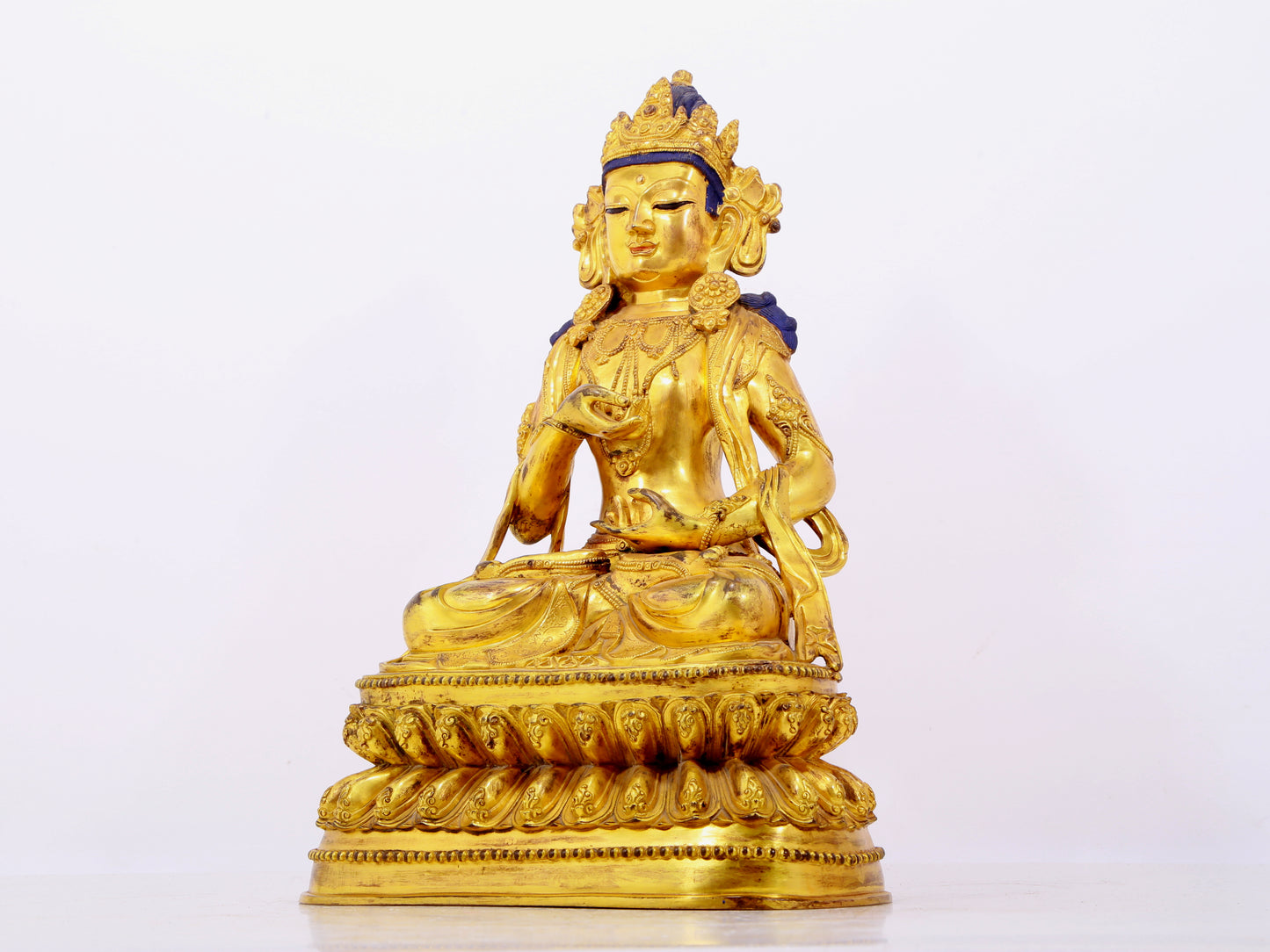 A solemn gilt bronze statue of Bodhisattva