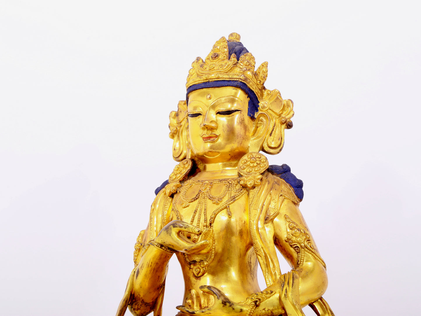 A solemn gilt bronze statue of Bodhisattva