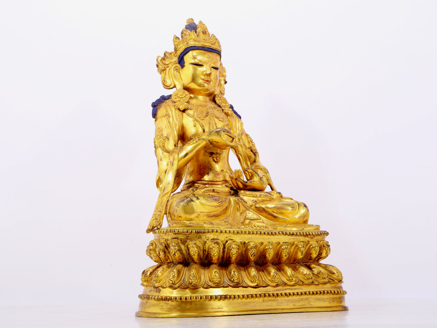 A solemn gilt bronze statue of Bodhisattva