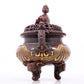 An exquisite gilt bronze elephant-patterned two-eared and tripod censer with lid