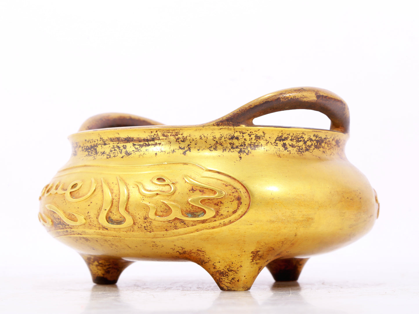 An exquisite gilt bronze Arabic censer with double ears and three legs