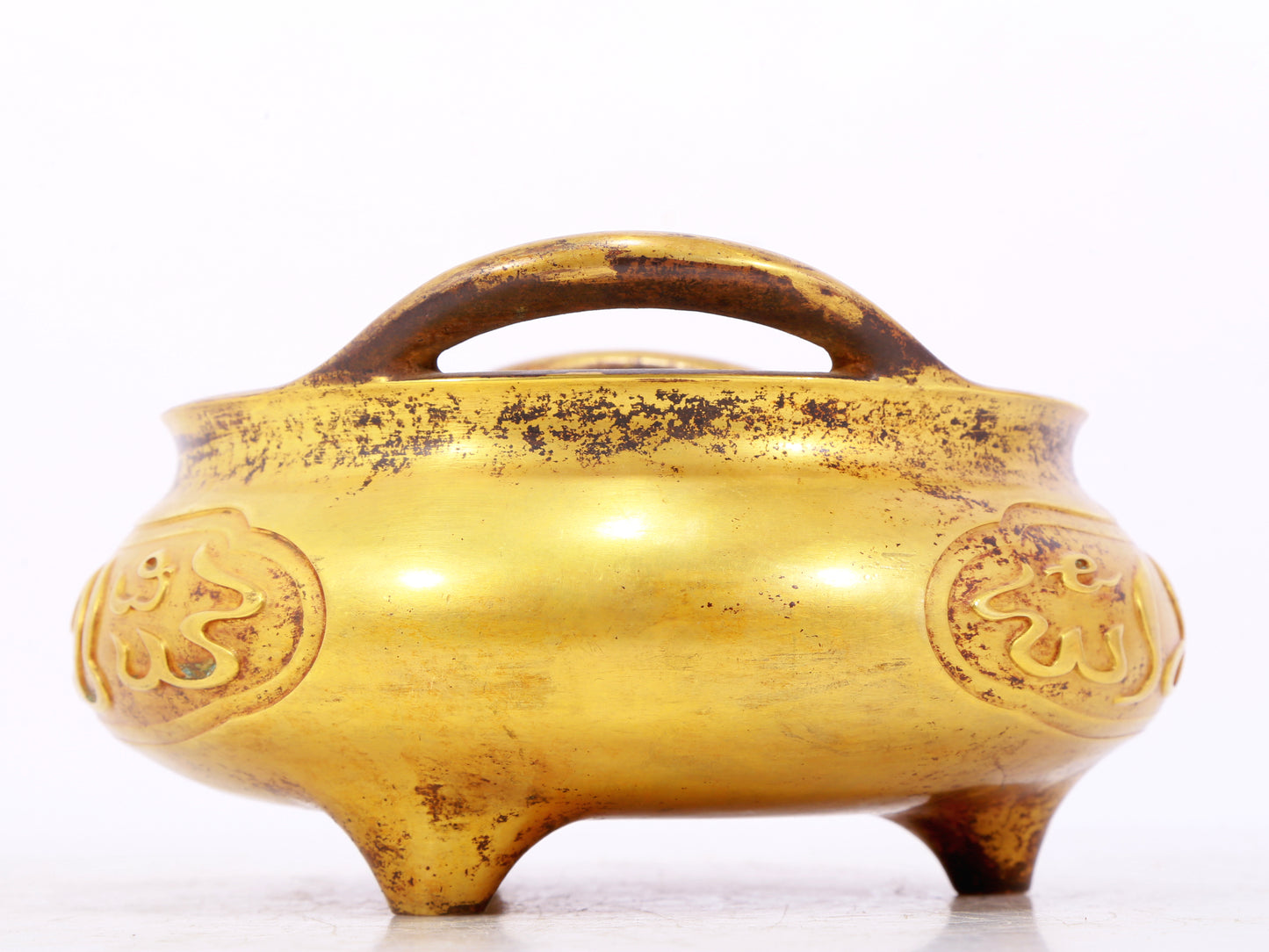 An exquisite gilt bronze Arabic censer with double ears and three legs