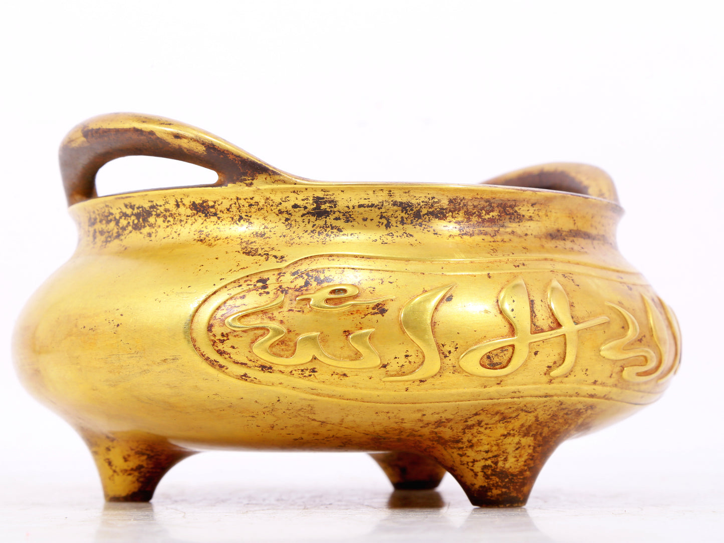 An exquisite gilt bronze Arabic censer with double ears and three legs