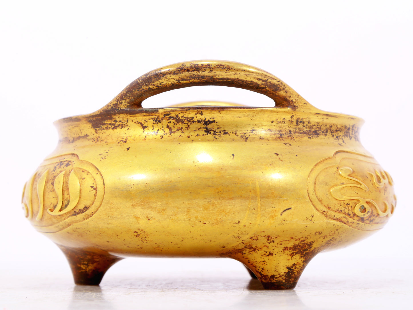 An exquisite gilt bronze Arabic censer with double ears and three legs