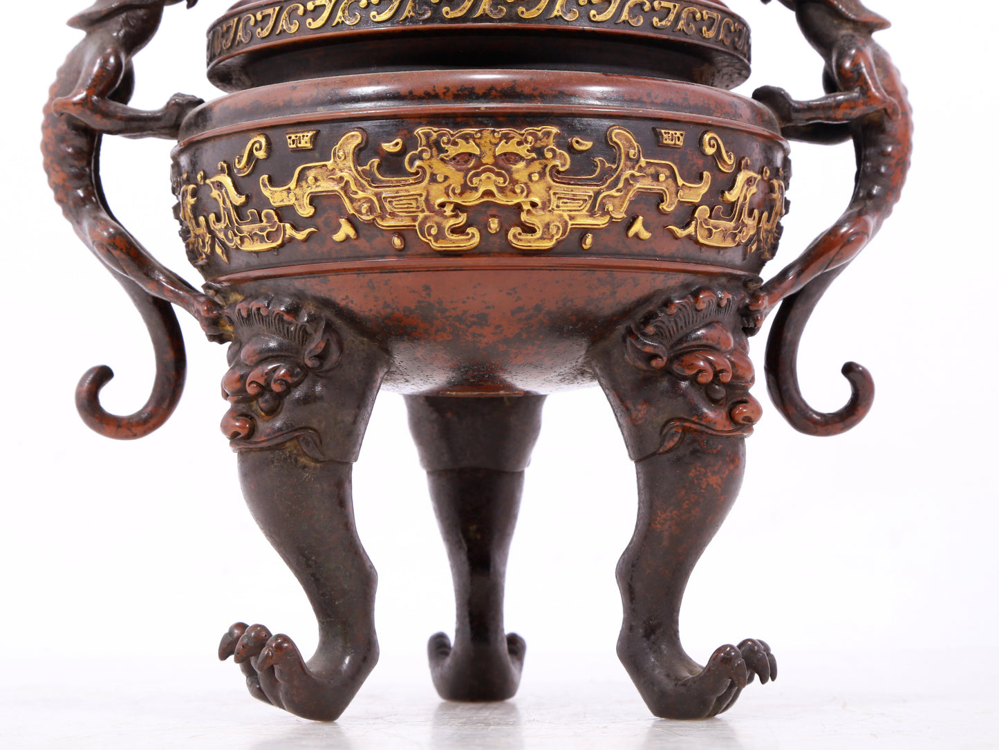 An exquisite gilt bronze double-eared and tripod censer with chilong pattern and lid