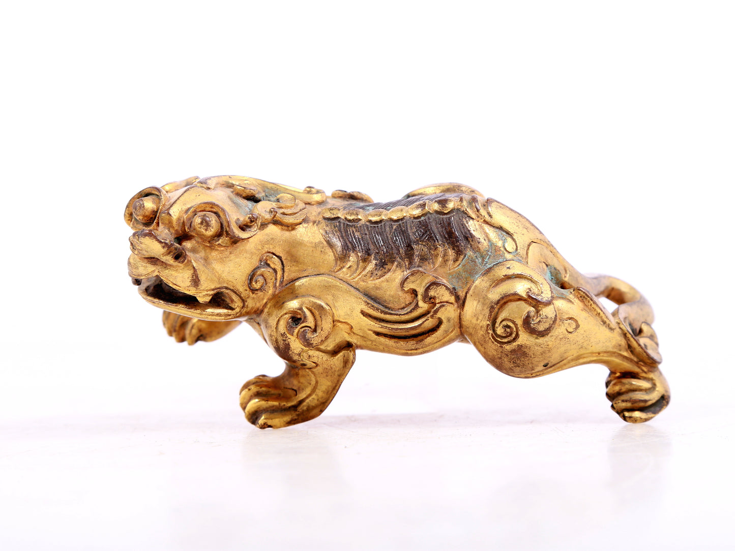 An exquisite gilt copper auspicious animal ornament