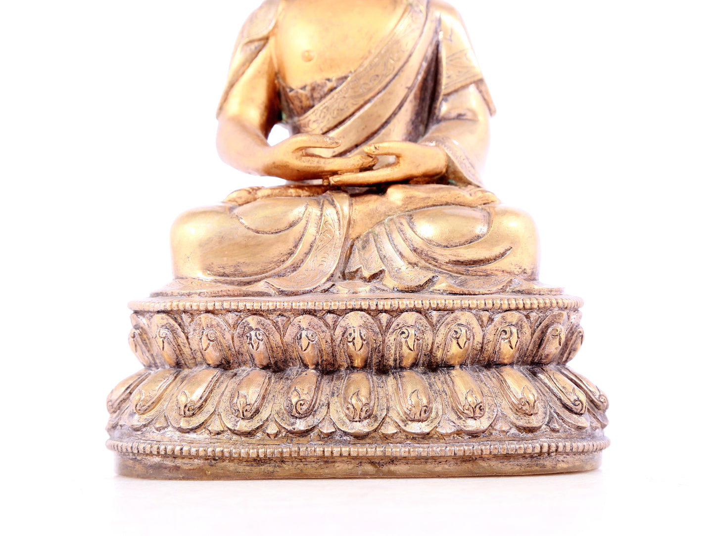 A solemn gilt bronze statue of Sakyamuni