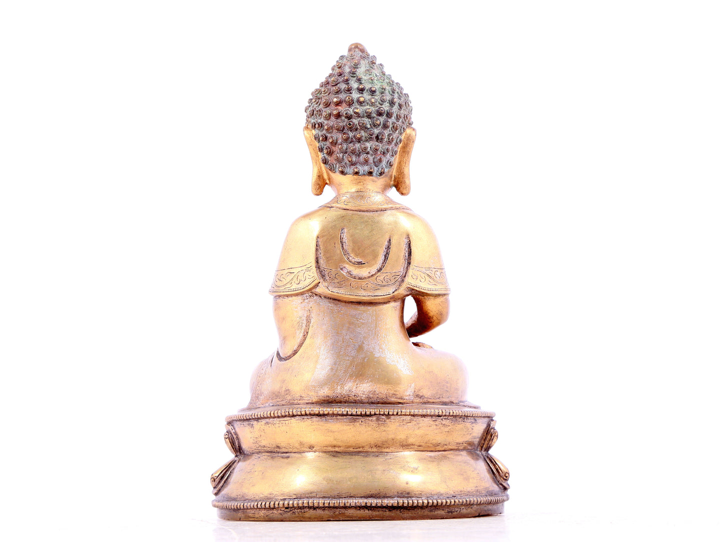 A solemn gilt bronze statue of Sakyamuni