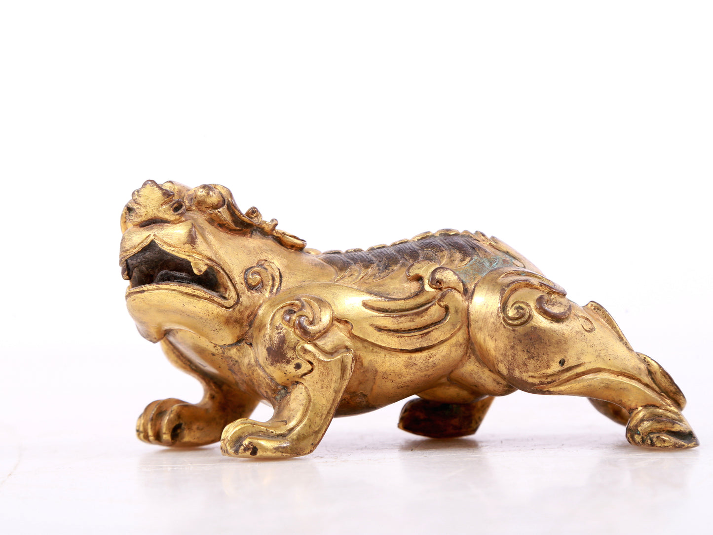 An exquisite gilt copper auspicious animal ornament