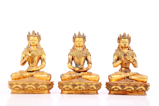 Three statues of a solemn gilt-bronze Bodhisattva