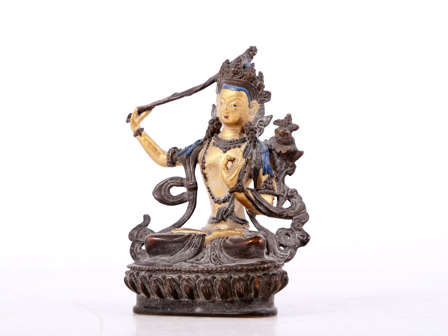 A solemn gilt bronze statue of Manjushri Bodhisattva