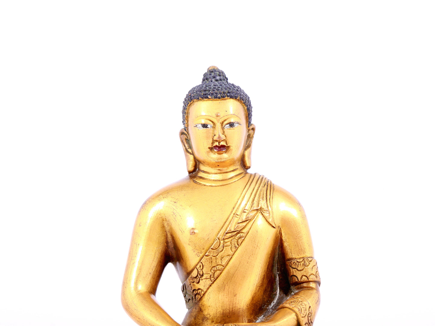 A solemn gilt bronze statue of Sakyamuni