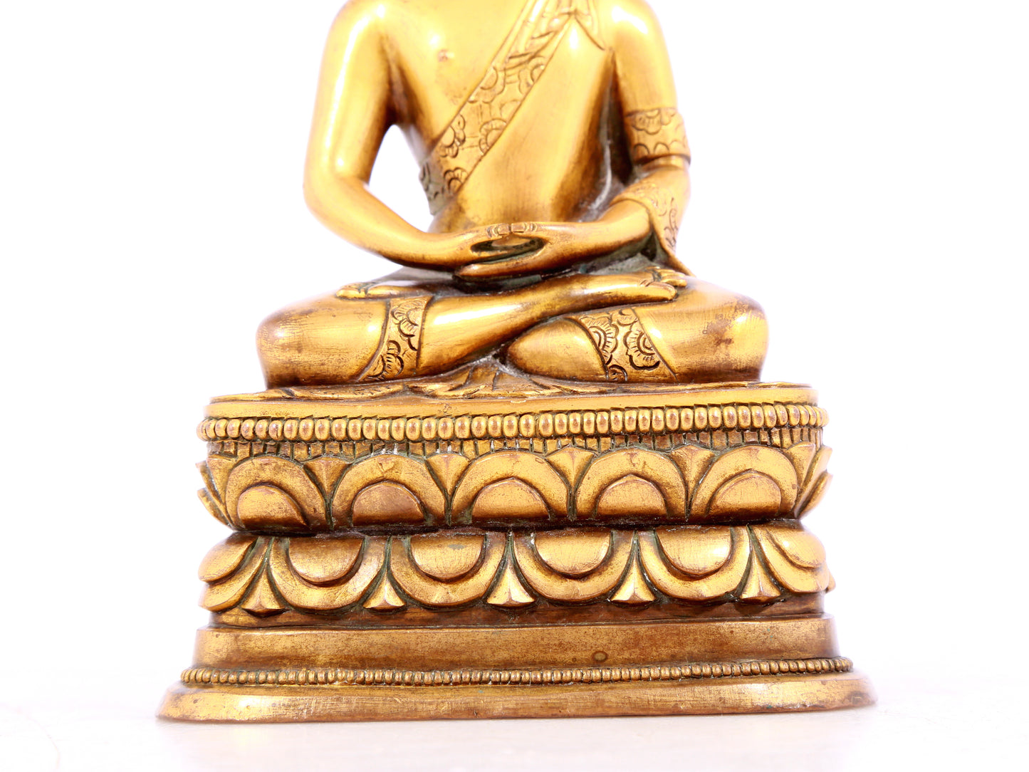 A solemn gilt bronze statue of Sakyamuni