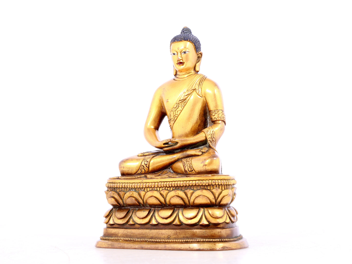 A solemn gilt bronze statue of Sakyamuni